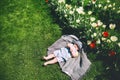 Baby in green grass of tulip field at springtime Royalty Free Stock Photo