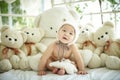 Baby with a group of plush bear