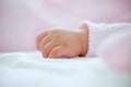 Baby, hand and closeup in bedroom for sleeping, health and growth with comfort, blanket and tired in house. Infant Royalty Free Stock Photo