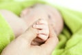 Baby hand gently holding adult's finger Royalty Free Stock Photo