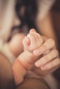 Baby hand gently holding adult's finger Royalty Free Stock Photo