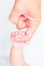 Baby hand holding adult finger Royalty Free Stock Photo