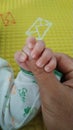 baby hand holding father& x27;s thumb Royalty Free Stock Photo