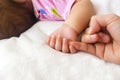 Baby hand holding mother finger. Royalty Free Stock Photo