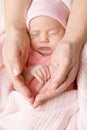 Baby Hand in Mother Palms. Newborn Girl sleeping with Blanket. Mum Love and Parents Care Concept. Infant Child Face Close up Royalty Free Stock Photo