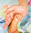 Baby hand in mother's palm Royalty Free Stock Photo