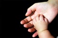 Baby hand in mother's palm Royalty Free Stock Photo