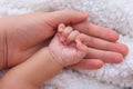 Baby hand in mother`s palm Royalty Free Stock Photo