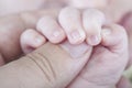 Baby, Hand of newborn. Hands of father and son united. Maternity