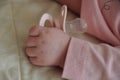 Baby hand with a nipple. Close up of baby hands with pacifier Royalty Free Stock Photo