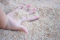 Baby hand plays sand. Royalty Free Stock Photo