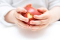 Baby hands with apple isolated on white