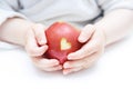 Baby hands with apple isolated on white