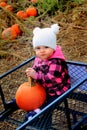 Baby happy in pumpkin patch wagon Royalty Free Stock Photo