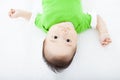 Baby having laughing and lying on the towel Royalty Free Stock Photo