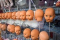 Baby heads display various items of clothing