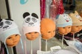 Baby heads display various items of clothing