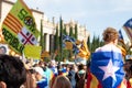 Baby held by his father and covered with catalan independentist flag during the rally at La Diada