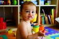 Baby in his room making funny faces of duck face Royalty Free Stock Photo