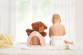 Baby and his teddy bear have training on potty Royalty Free Stock Photo