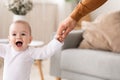 Baby Holding Dad& x27;s Hand Learning To Walk At Home