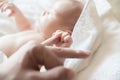 Baby holding a finger of his parent Royalty Free Stock Photo
