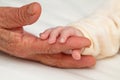 Baby Holding Great GrandmaÃ¢â¬â¢s Finger Royalty Free Stock Photo