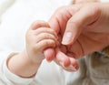 Baby holding mother hand Royalty Free Stock Photo