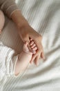 baby holding mother's finger, cute motherhood, New mom and newborn baby hands close up Royalty Free Stock Photo