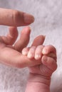 Baby holding onto Mother`s hand Royalty Free Stock Photo