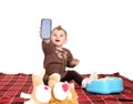 Baby holding up a cell phone. Royalty Free Stock Photo