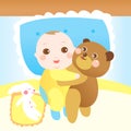 Baby hugging teddy bear on the bed