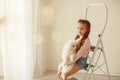 Baby Hugs the white fluffy puppy. Kids Royalty Free Stock Photo