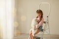 Baby Hugs the white fluffy puppy. Kids Royalty Free Stock Photo