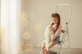 Baby Hugs the white fluffy puppy. Kids Royalty Free Stock Photo