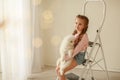Baby Hugs the white fluffy puppy. Kids Royalty Free Stock Photo