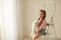 Baby Hugs the white fluffy puppy. Kids Royalty Free Stock Photo