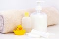 baby hygiene and bath items, shampoo bottle, baby soap, towel, yellow duck rubber toy, Royalty Free Stock Photo