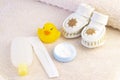 baby hygiene and bath items, shampoo bottle, baby soap, towel, yellow duck rubber toy, Royalty Free Stock Photo