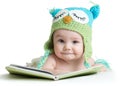 Baby infant in funny owl knitted hat owl with book on white background Royalty Free Stock Photo