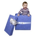 Baby inside a gift box isolated on a white background