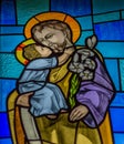 Baby Jesus kisses his father Joseph