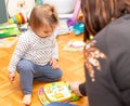 Baby. Joy. Girl. Reading. Book. Mother Royalty Free Stock Photo