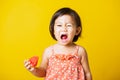 Baby or kid cute little girl attractive laugh smile wearing t-shirt playing holds cut watermelon fresh for eating Royalty Free Stock Photo