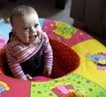 Baby kid in playpen laughing Royalty Free Stock Photo