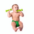 Baby kid, toddler in green diapers doing exercises with dumbbel Royalty Free Stock Photo