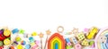 Baby kids toy banner background. Colorful educational toys on white background. Top view, flat lay, copy space for text