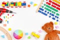Baby kids toys background with teddy bear, toy tools, wooden train, cars and colorful blocks. Top view, flat lay Royalty Free Stock Photo