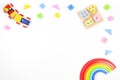 Baby kids toys background. Wooden educational geometric stacking blocks toy, rainbow, wood train and colorful blocks on Royalty Free Stock Photo