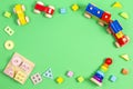 Baby kids toys background. Wooden educational geometric stacking blocks toy, wooden train, cars, stacking pyramid tower Royalty Free Stock Photo